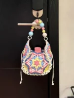 Crochet Starburst Pouch – Figurine Granny Square & Beaded Handle